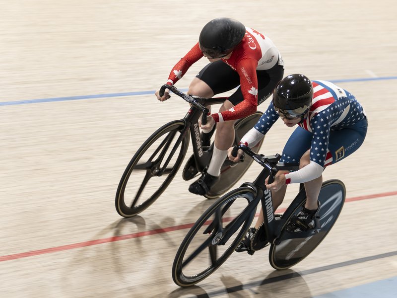 McKenna and another cyclist on the track at Bromont, McKenna in the sprinters lane